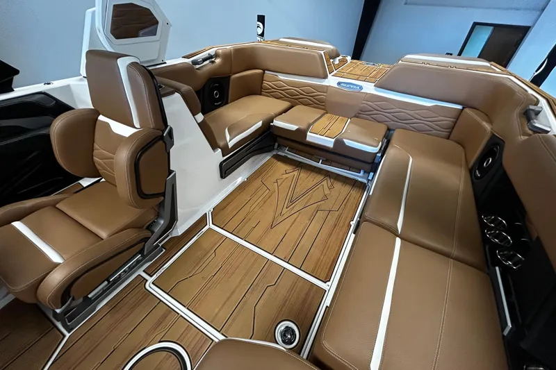 Slide: The Image of 2025 Supra SA boat interior with luxurious brown leather seating and modern design. - 7