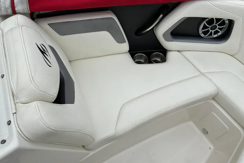 Slide: The Image of 2013 Monterey 214SS Super Sport boat interior with white seating and speaker. - 18