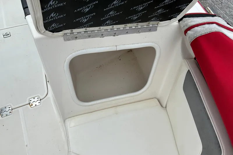 Slide: The Image of Open storage compartment on 2013 Monterey 214SS Super Sport boat interior. - 20