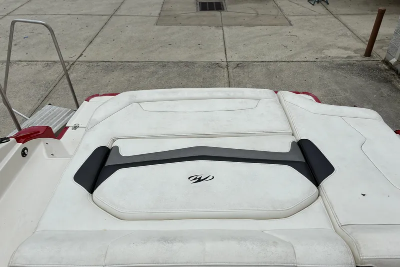 Slide: The Image of 2013 Monterey 214SS Super Sport boat with white cushioned seating and swim platform. - 23