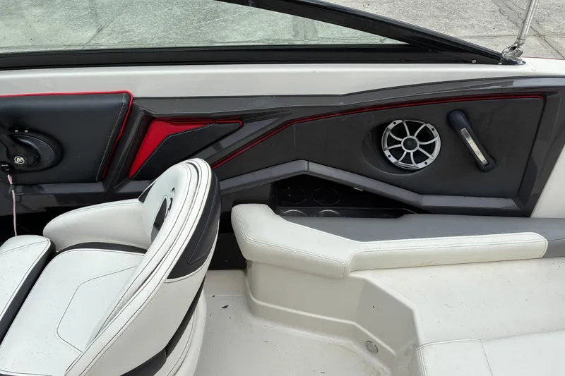 Slide: The Image of Interior of a 2013 Monterey 214SS Super Sport boat, featuring seating and speaker. - 6
