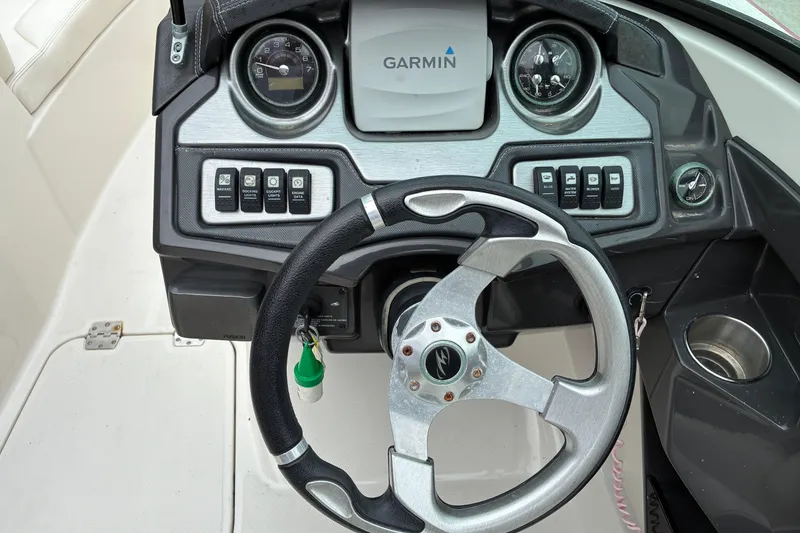 Slide: The Image of 2013 Monterey 214SS Super Sport dashboard with Garmin navigation and steering wheel. - 7