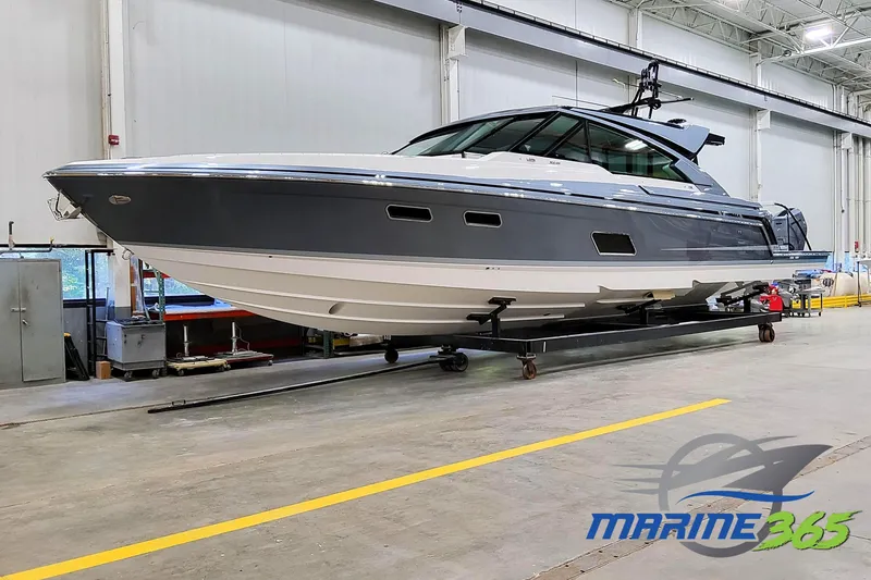 The Image of 2026 Formula 500 Super Sport Crossover boat in a spacious indoor facility. - 0