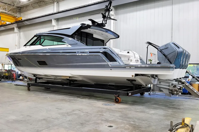 Slide: The Image of 2026 Formula 500 Super Sport Crossover boat in a workshop setting. - 1