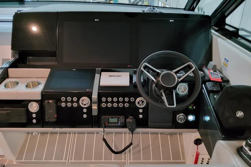 Slide: The Image of 2026 Formula 500 Super Sport Crossover dashboard with modern controls and steering wheel. - 12