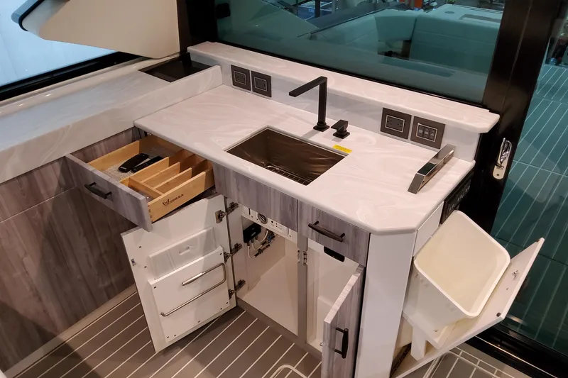 Slide: The Image of Modern kitchen area in 2026 Formula 500 Super Sport Crossover yacht. - 18