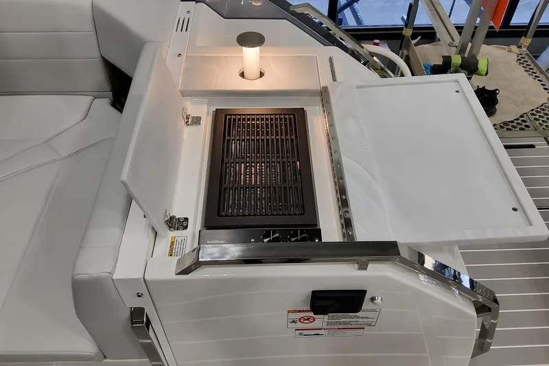 Slide: The Image of 2026 Formula 500 Super Sport Crossover boat grill with sleek design and ambient lighting. - 24