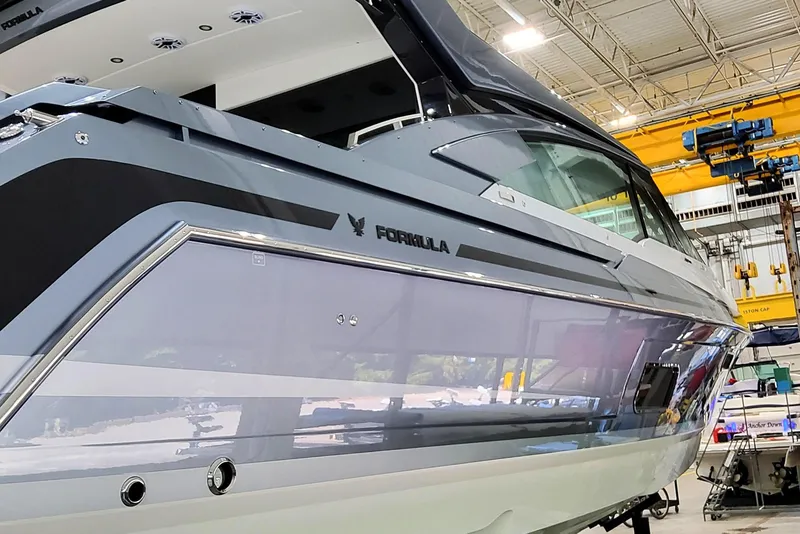 Slide: The Image of 2026 Formula 500 Super Sport Crossover boat in a manufacturing facility. - 3