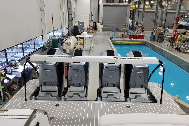 Slide: The Image of 2026 Formula 500 Super Sport Crossover with four powerful outboard engines in a workshop setting. - 30