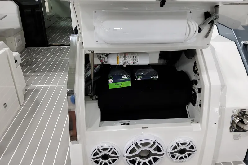 Slide: The Image of 2026 Formula 500 Super Sport Crossover boat interior with storage compartment and speakers. - 35