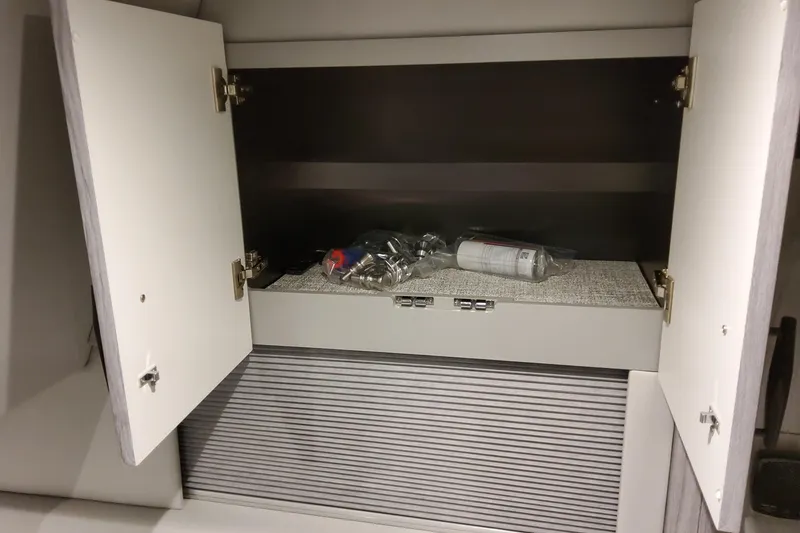 Slide: The Image of Open cabinet in 2026 Formula 500 Super Sport Crossover, showing interior storage space. - 38