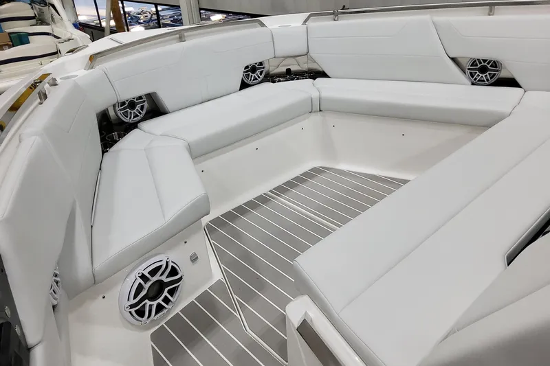 Slide: The Image of 2026 Formula 500 Super Sport Crossover boat interior with white seating and modern speakers. - 49