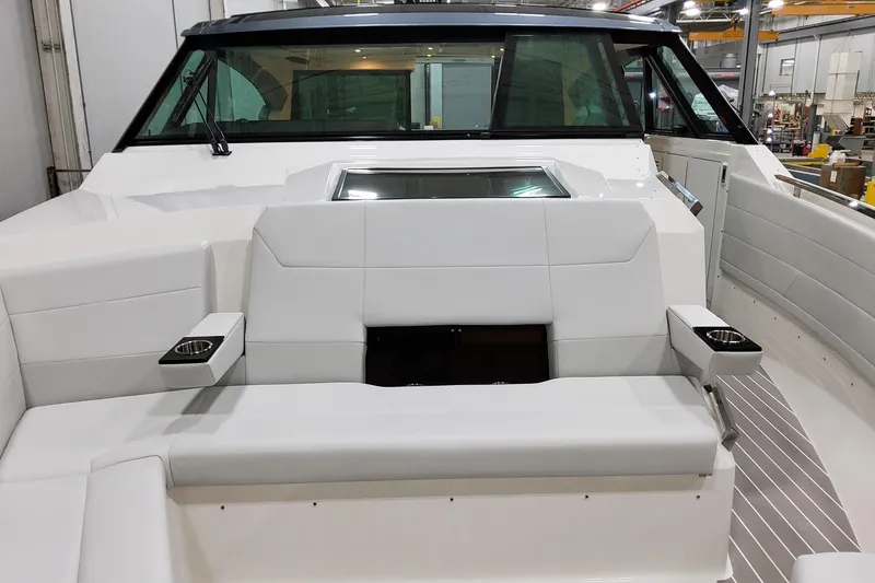 Slide: The Image of 2026 Formula 500 Super Sport Crossover boat interior with white seating and cup holders. - 6