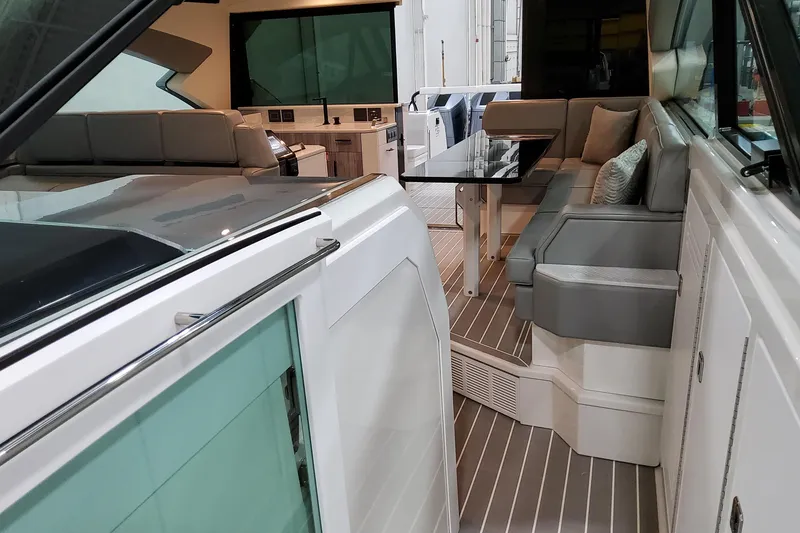 Slide: The Image of Luxurious interior of 2026 Formula 500 Super Sport Crossover yacht with sleek seating and table. - 7