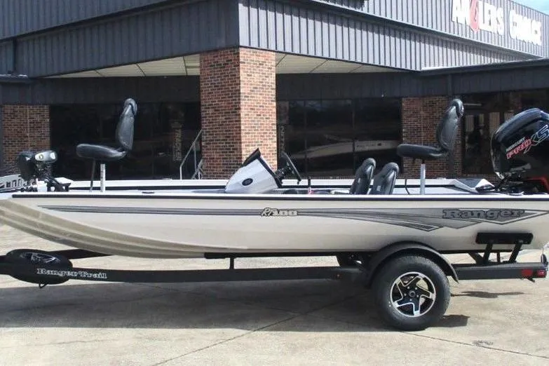 The Image of 2026 Ranger RT188 fishing boat on trailer, parked outside a building. - 1