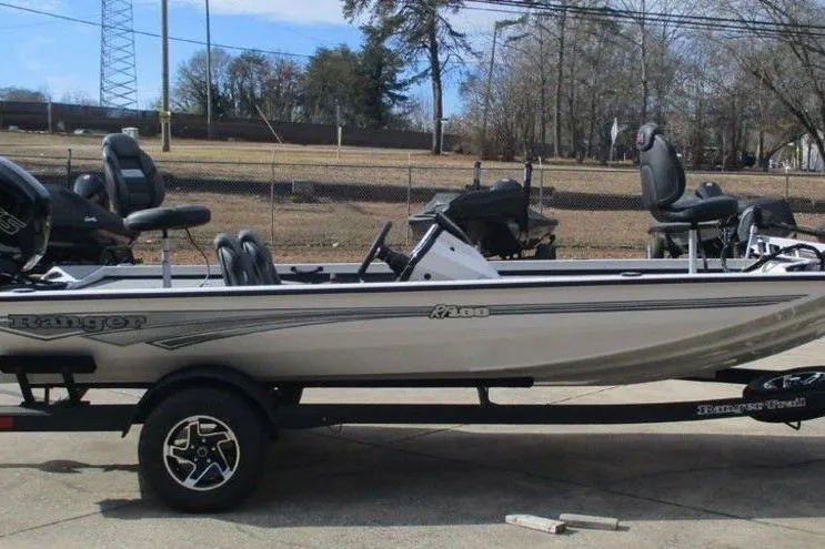 Slide: The Image of 2026 Ranger RT188 fishing boat on trailer, side view, outdoors. - 3