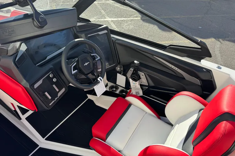Slide: The Image of 2026 Supra SE 575 boat interior with red and white seats, modern dashboard, and steering wheel. - 8