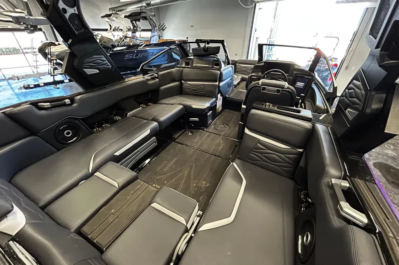 Slide: The Image of Luxurious interior of 2025 Supra SA boat with sleek black seating and modern design. - 5