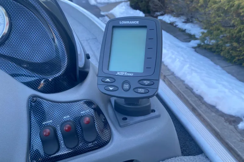 Slide: The Image of 2010 Tracker Pro Team 170 TX boat dashboard with Lowrance X51 Pro fishfinder. - 10