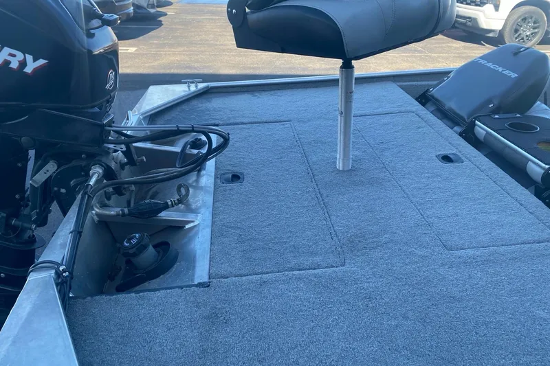 Slide: The Image of 2010 Tracker Pro Team 170 TX boat deck with motor and seating. - 11