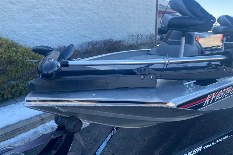 Slide: The Image of 2010 Tracker Pro Team 170 TX boat with trolling motor, parked on a trailer. - 13