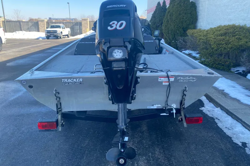 Slide: The Image of 2010 Tracker Pro Team 170 TX boat with Mercury 30 engine, parked outdoors. - 15