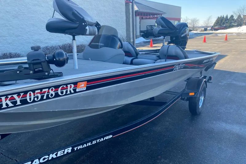 Slide: The Image of 2010 Tracker Pro Team 170 TX boat on trailer, parked outdoors. - 2
