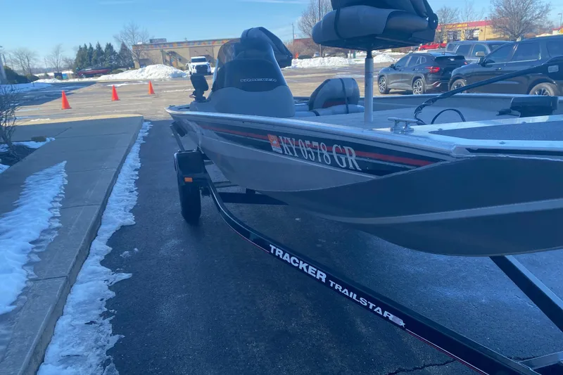 Slide: The Image of 2010 Tracker Pro Team 170 TX boat on trailer in snowy parking lot. - 6