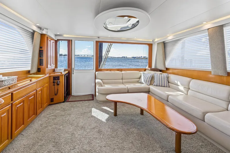 Slide: The Image of Luxurious interior of 1998 Viking 72 Enclosed Bridge yacht with ocean view. - 13
