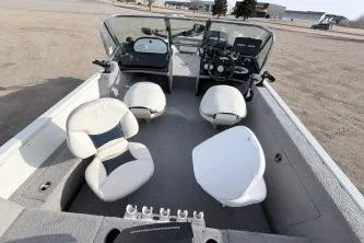 Slide: The Image of 2009 Starcraft Starfire 1600 DC boat interior with seating and control panel. - 4