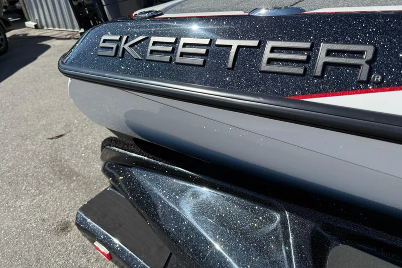 Slide: The Image of 2026 Skeeter FXR20 Apex boat with metallic finish, close-up view. - 11