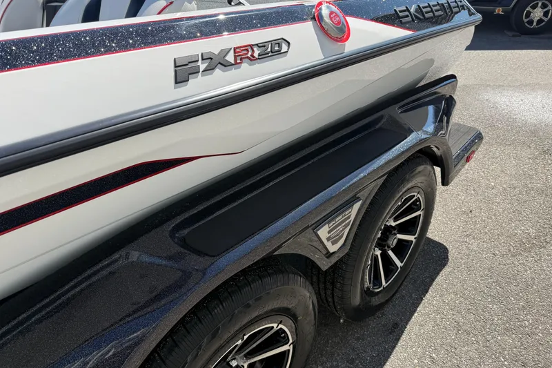 Slide: The Image of 2026 Skeeter FXR20 Apex boat on trailer, showcasing sleek design and branding. - 12
