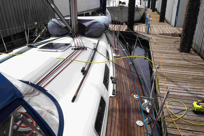 Slide: The Image of 2004 Dufour 40 Performance sailboat docked, showcasing deck and rigging details. - 30