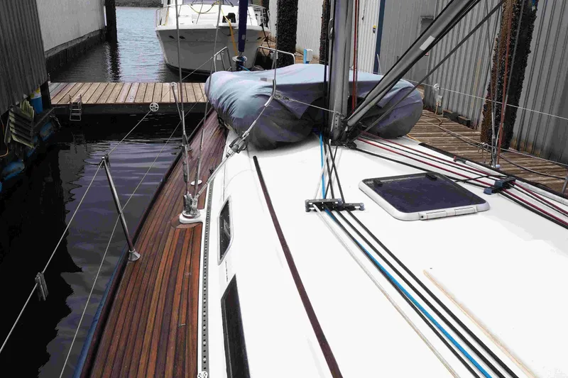 Slide: The Image of 2004 Dufour 40 Performance sailboat docked, showcasing deck and rigging details. - 31