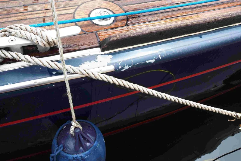 Slide: The Image of Close-up of 2004 Dufour 40 Performance yacht with ropes and fender. - 39