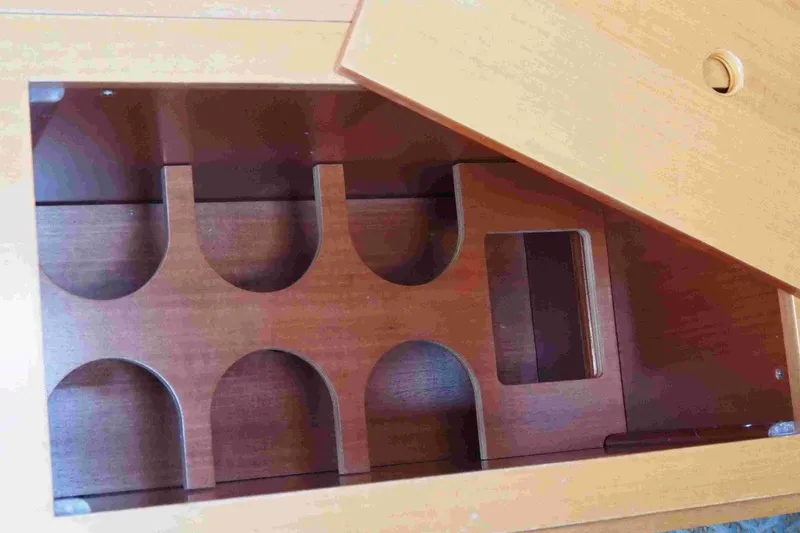 Slide: The Image of Wooden wine rack inside a 2004 Dufour 40 Performance yacht. - 54