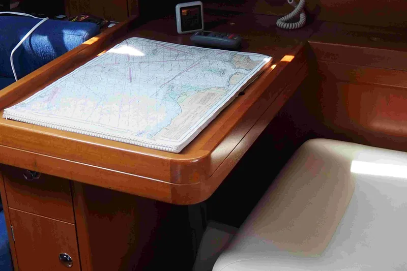 Slide: The Image of Navigation table with map inside 2004 Dufour 40 Performance yacht cabin. - 56