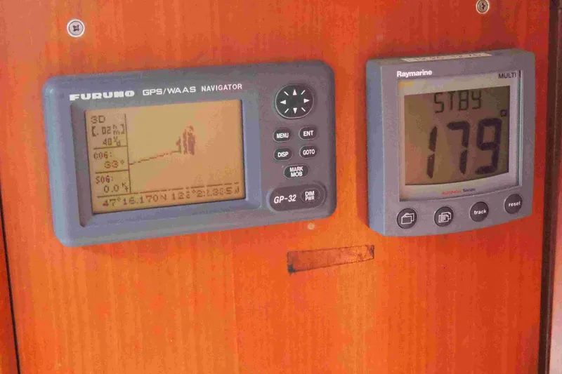 Slide: The Image of Navigation instruments on a 2004 Dufour 40 Performance yacht dashboard. - 60
