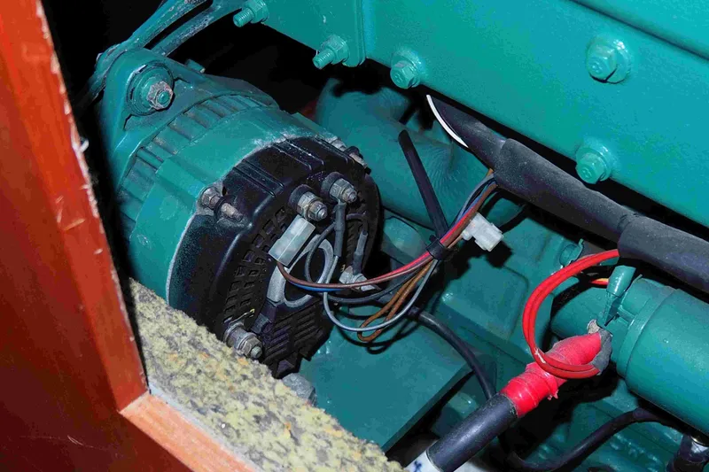 Slide: The Image of Engine compartment of a 2004 Dufour 40 Performance sailboat, showing wiring and components. - 69