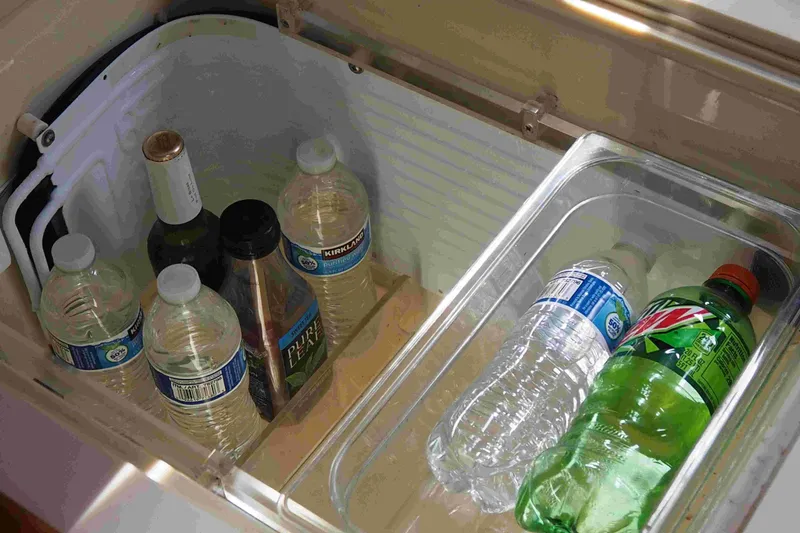 Slide: The Image of Beverages stored in a Dufour 40 Performance yacht's fridge, including water and soda bottles. - 72