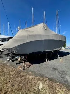 Slide: The Image of 2006 Bayliner 325 boat covered on a dry dock. - 8