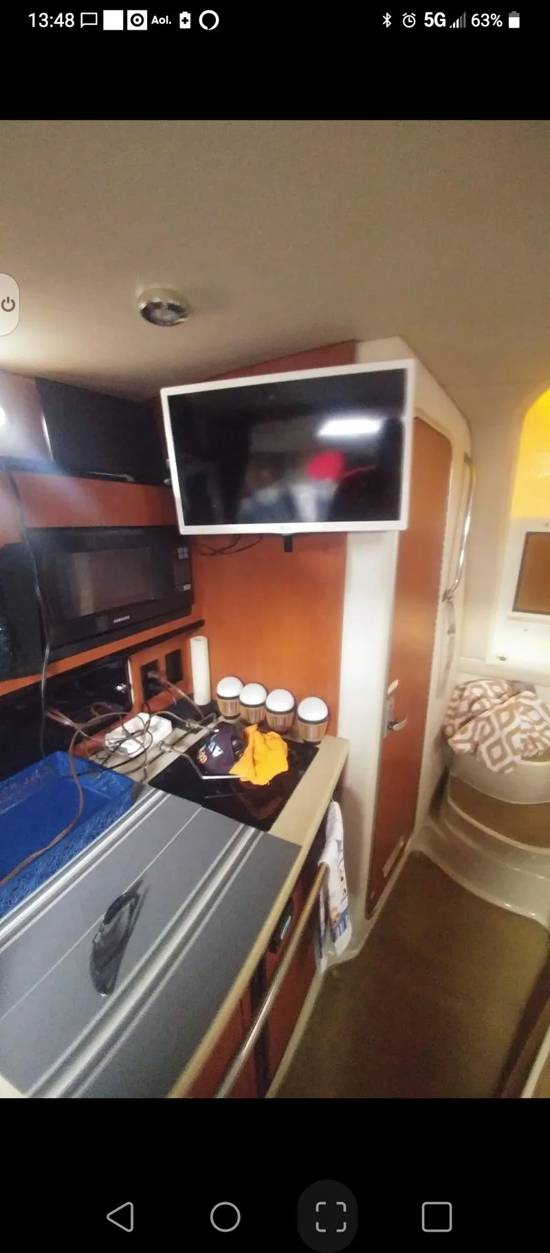 Slide: The Image of Interior of a 2004 Chaparral Signature 270 yacht with TV and cabinets. - 6