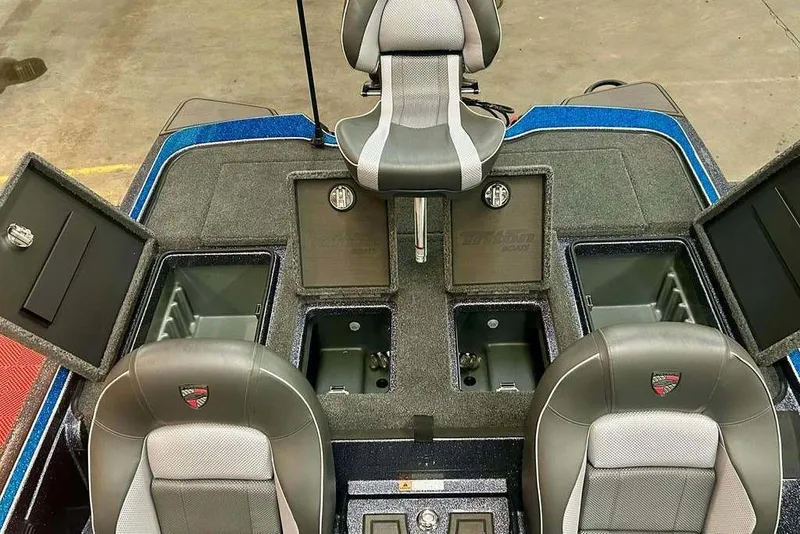 Slide: The Image of 2026 Triton 20XP Patriot boat interior with storage compartments and seating. - 16