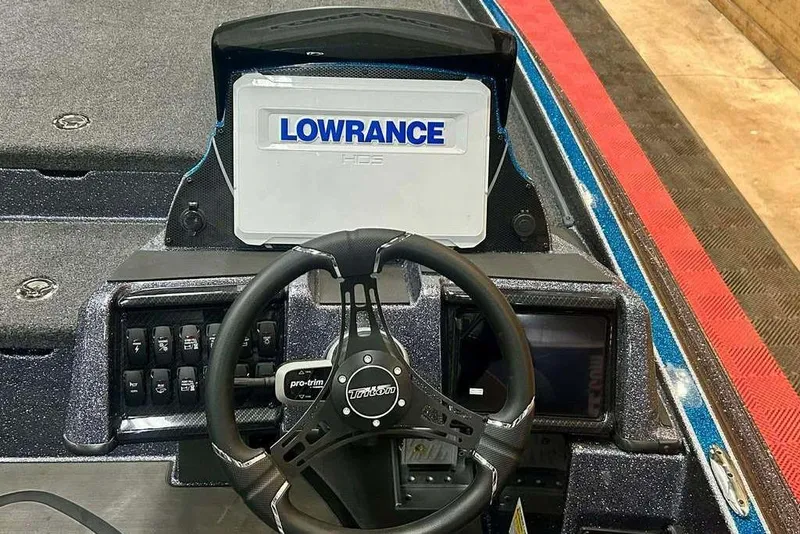 Slide: The Image of Steering console of 2026 Triton 20XP Patriot boat with Lowrance HDS display. - 4