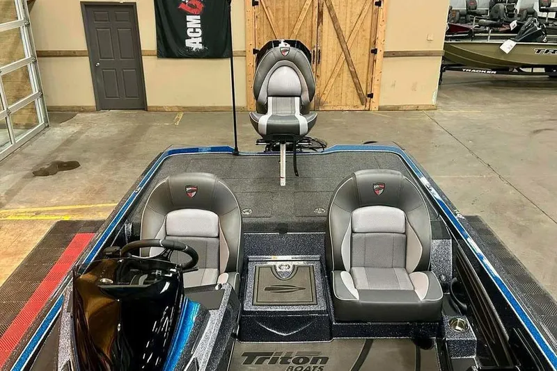 Slide: The Image of 2026 Triton 20XP Patriot boat interior with sleek seating and modern design. - 7