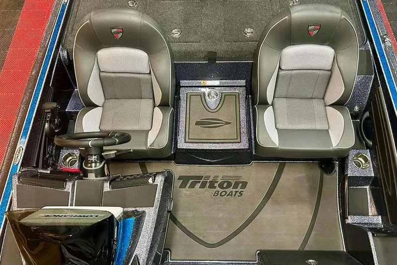 Slide: The Image of 2026 Triton 20XP Patriot boat interior with dual seats and steering wheel. - 9