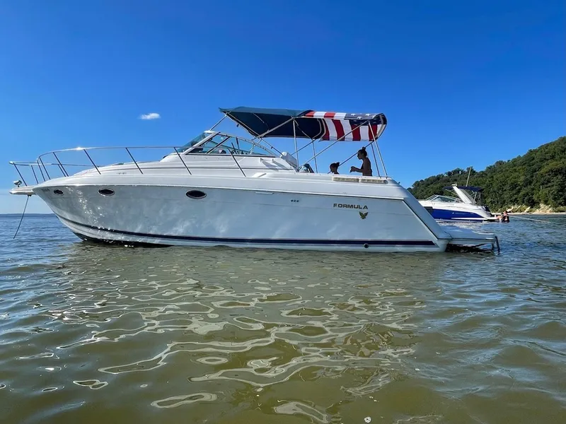 Slide: The Image of 2000 Formula 34 Performance Cruiser on calm water. - 1