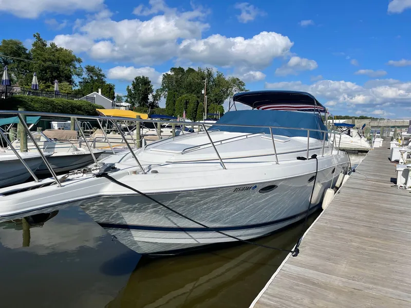 Slide: The Image of 2000 Formula 34 Performance Cruiser docked on a sunny day. - 2