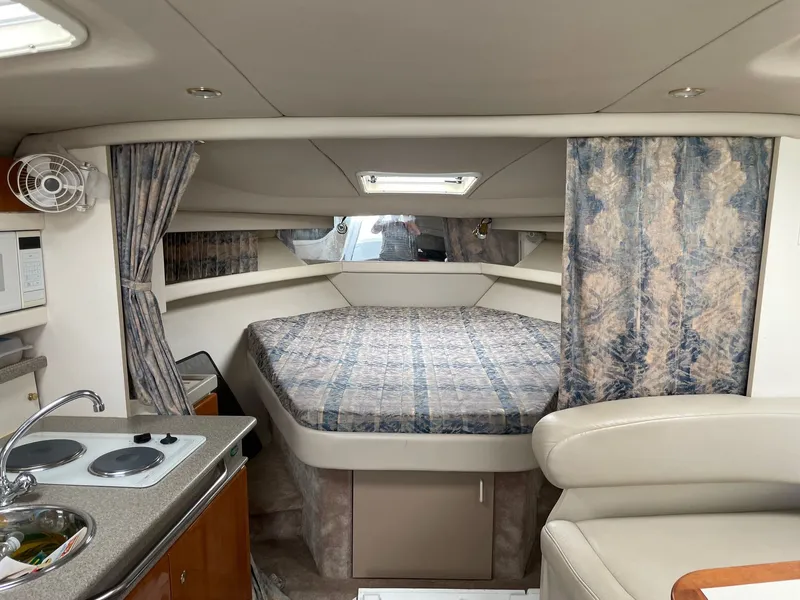 Slide: The Image of Interior of a 2000 Formula 34 Performance Cruiser with bed and kitchenette. - 6