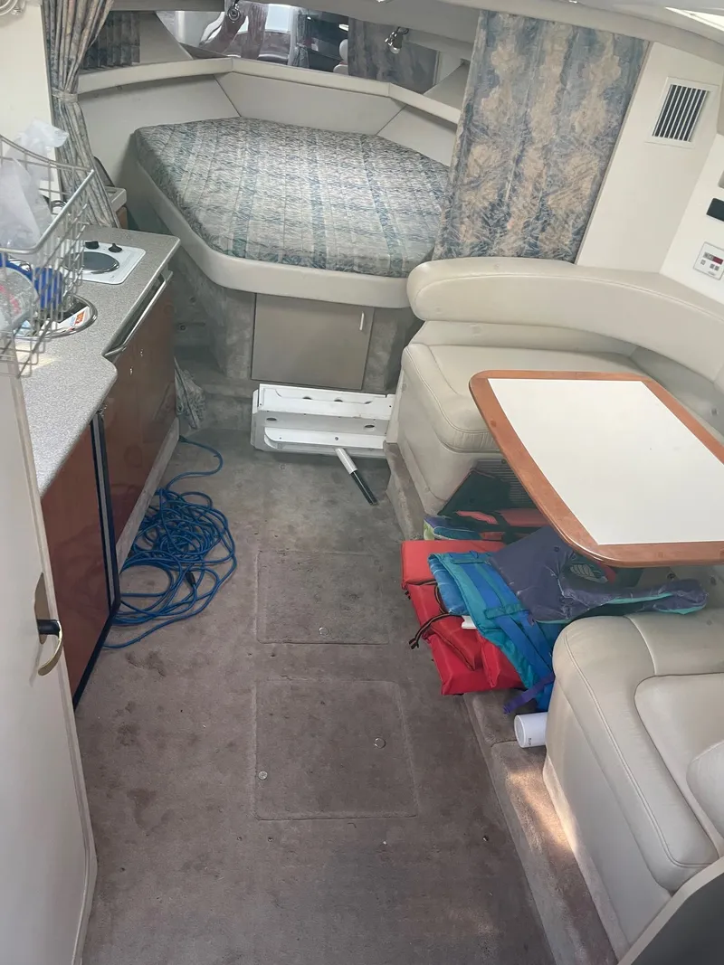 Slide: The Image of Interior of a 2000 Formula 34 Performance Cruiser with kitchen and sleeping area. - 8